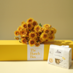 The Euro Orange Tea Break Bundle pairs the radiant energy of five Euro Orange spray chrysanthemums with the artisanal quality of 200g Loison Canestrello biscuits. Presented in a color-matched signature yellow long-form gift box, this set offers a professional and spirited gifting solution that blends high-end floristry with the heritage of premium Italian confectionery. It is a sophisticated way to share a moment of warmth and refined taste.