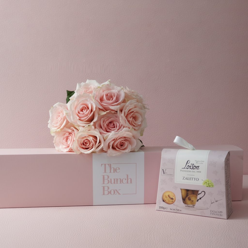 Harmony Blooms and Sweet Bites combines the gentle elegance of ten Harmony Peach roses with the artisanal quality of 200g Loison Zaletto biscuits. Presented in our signature long-form gift box, this set offers a refined and modern gifting solution that blends premium floristry with the heritage of traditional Italian pastry. It is a sophisticated choice for those looking to send a gesture of warmth and luxury.