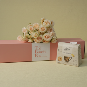 Salinero Softness and Sweets features five stems of romantic, peach-pink Salinero spray roses paired with 200g of buttery Loison Canestrello biscuits. Presented in our signature pink long-form gift box, this set offers a sophisticated and gentle gifting solution that blends delicate botanical beauty with the heritage of premium Italian confectionery. Perfect for moments that require a touch of softness and refined taste.