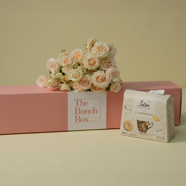 Salinero Softness and Sweets features five stems of romantic, peach-pink Salinero spray roses paired with 200g of buttery Loison Canestrello biscuits. Presented in our signature pink long-form gift box, this set offers a sophisticated and gentle gifting solution that blends delicate botanical beauty with the heritage of premium Italian confectionery. Perfect for moments that require a touch of softness and refined taste.